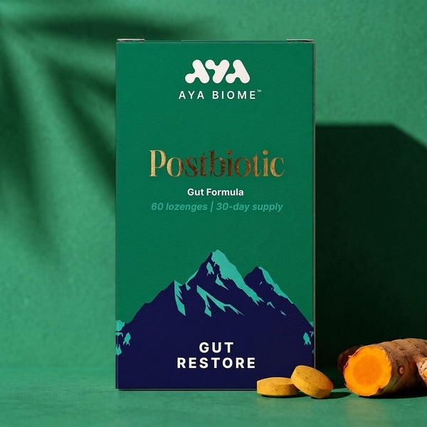 AYA BIOME™ Gut Restore box with two chewable tablets and fresh turmeric root