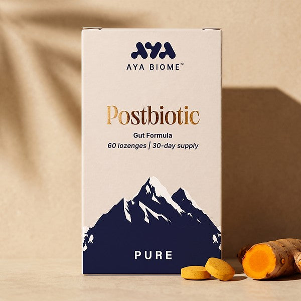 AYA BIOME™ PURE box with two chewable tablets and fresh turmeric root