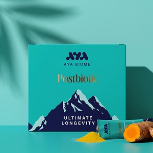 AYA BIOME™ Ultimate Longevity box with a stick pack and fresh turmeric root